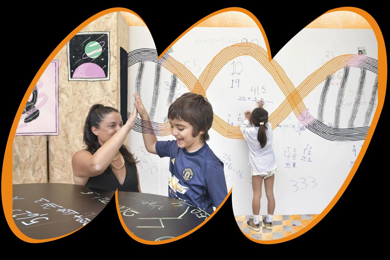Teacher and student celebrating success at Miami microschool Wisdom Warehouse